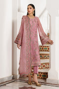 Woman wearing a pink embroidered traditional outfit in an ornate interior setting