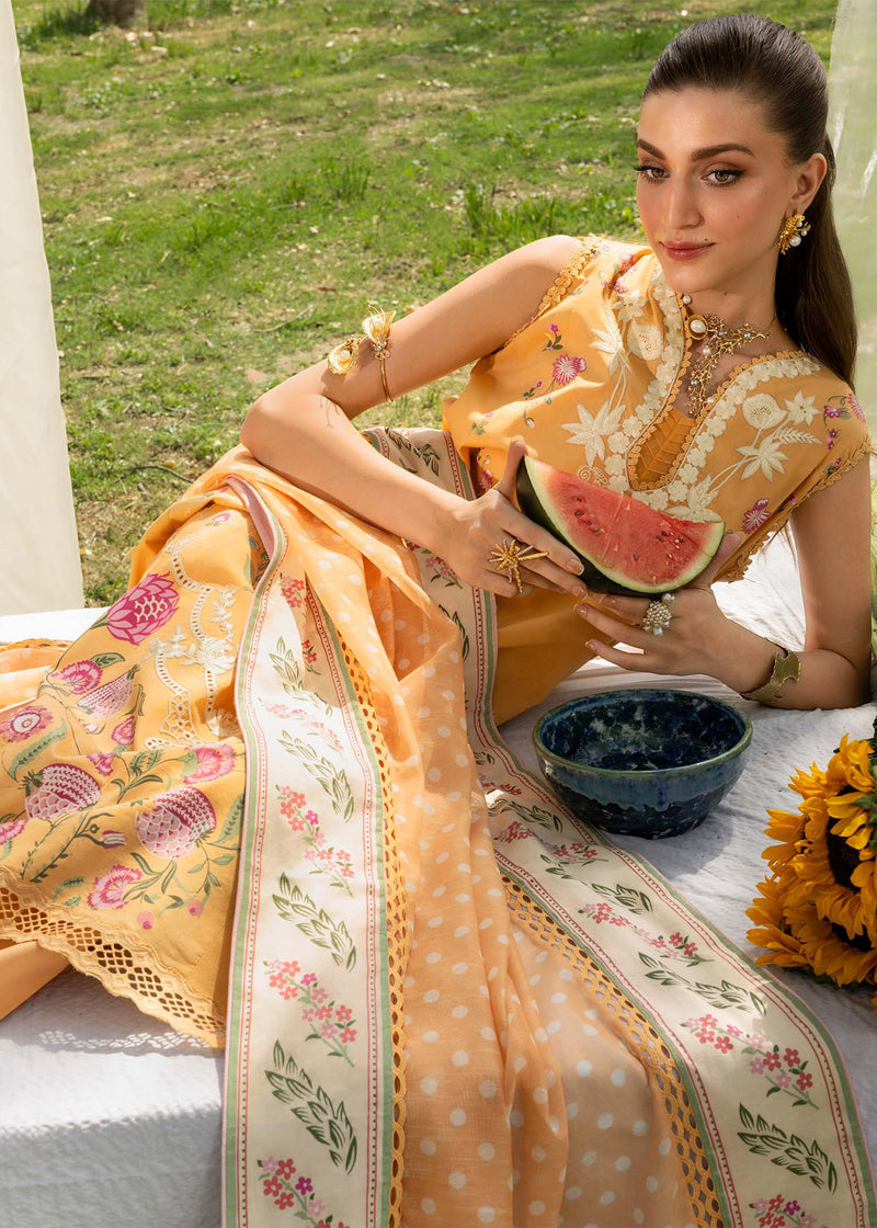 Woman in a traditional outfit holding a watermelon in an outdoor setting