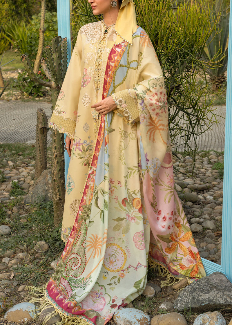 Woman wearing a colorful floral dress with a patterned shawl in an outdoor setting.