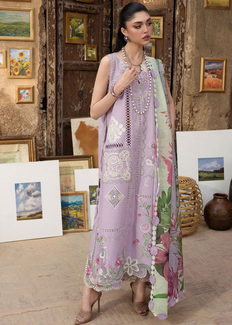 Woman in a floral dress standing in an art gallery with paintings on the wall.