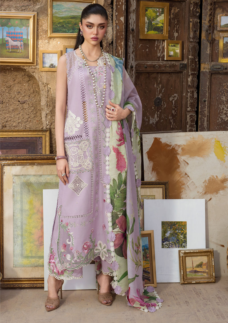 Woman in a floral dress standing in front of artistic background with paintings