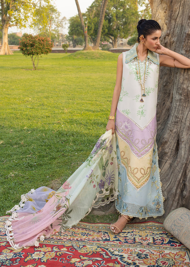 Woman in a traditional outfit standing by a tree in a park