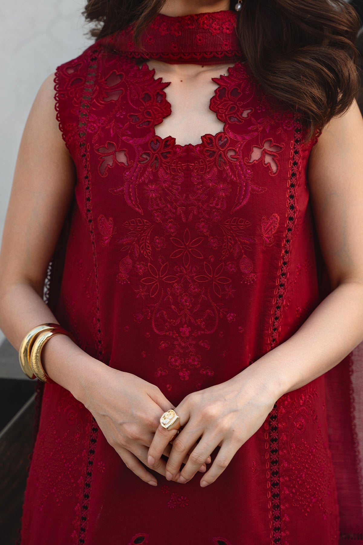 Red embroidered dress with intricate patterns on a plain background
