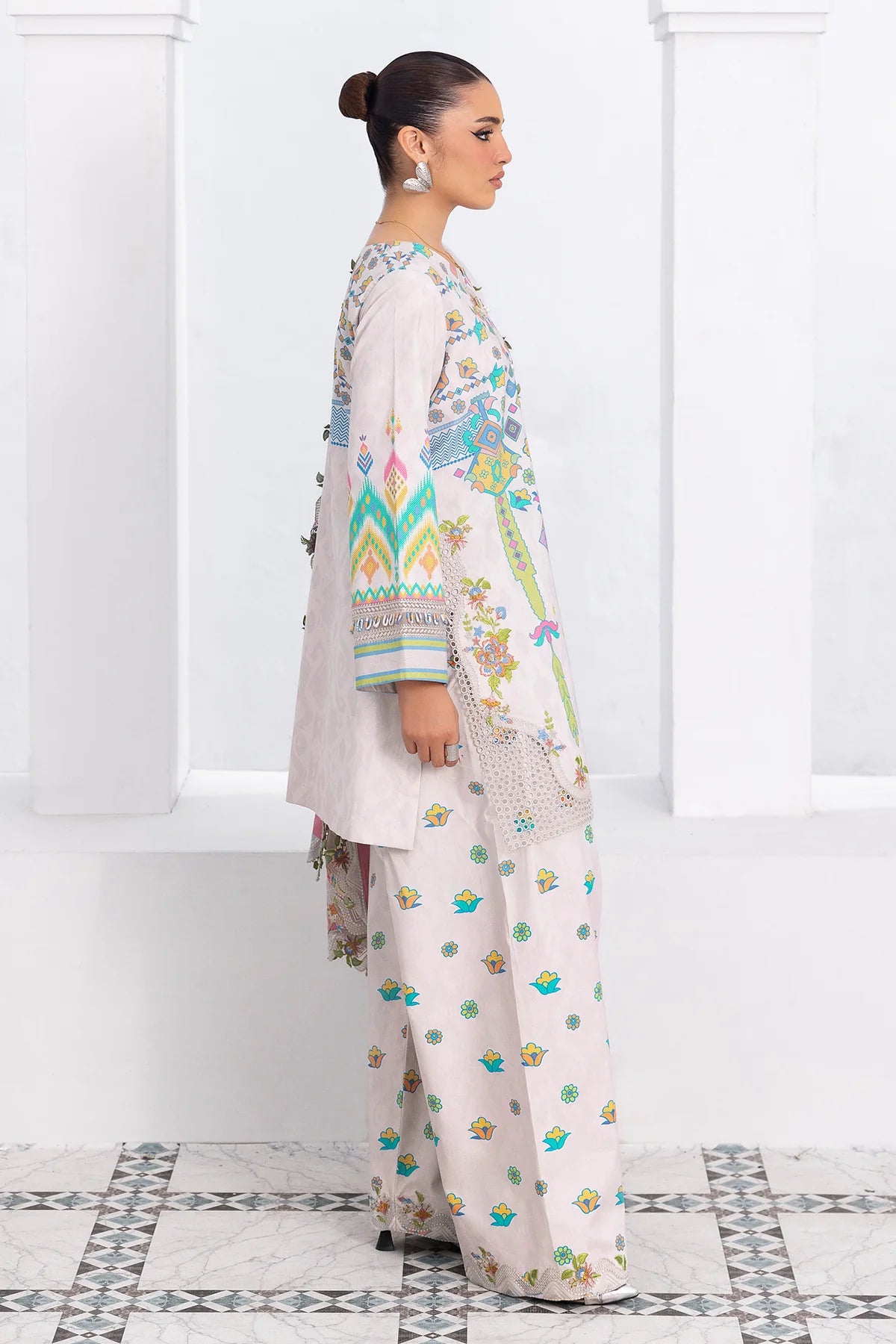 Woman wearing a floral outfit with a white background