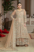 A woman wearing a traditional, peach-colored lehnga set with embroidery and a dupatta with a 4-inch embroidered mathapatti.