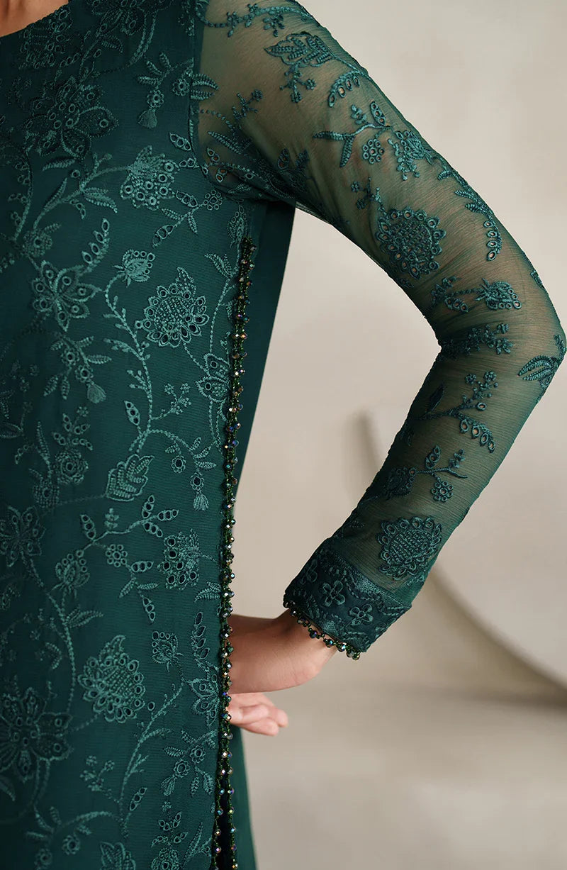 Green lace dress with long sleeves on a neutral background