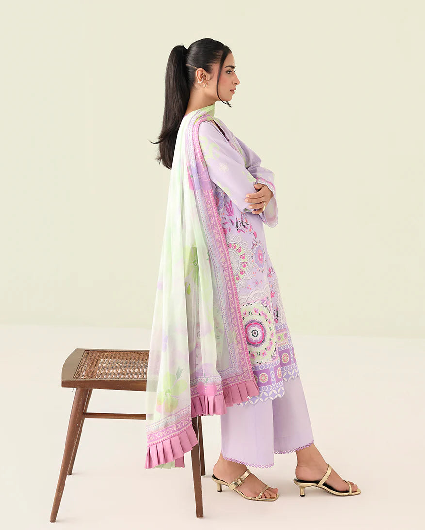 Woman wearing a light pink and white traditional outfit with a floral dupatta on a beige background