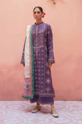 Woman wearing a traditional outfit with a pink background