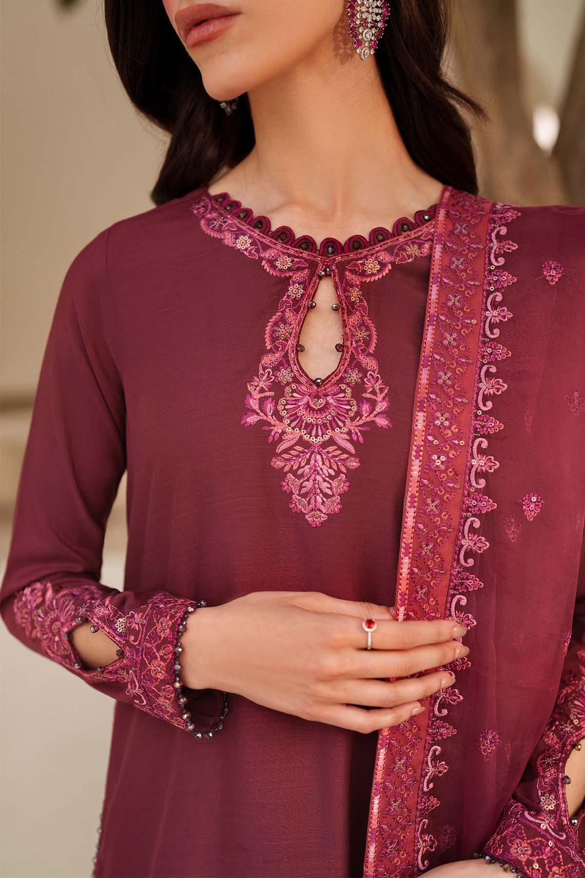 Maroon embroidered traditional outfit with matching dupatta on a neutral background