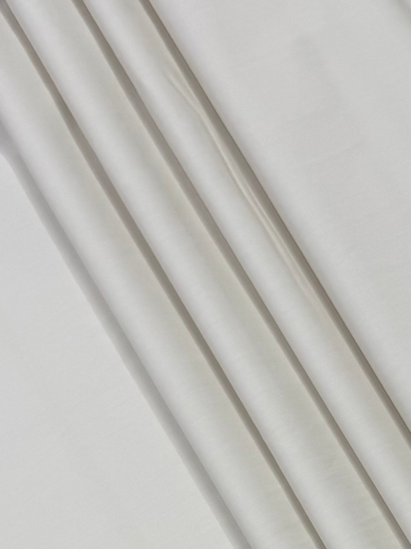 Close-up of white fabric with visible texture