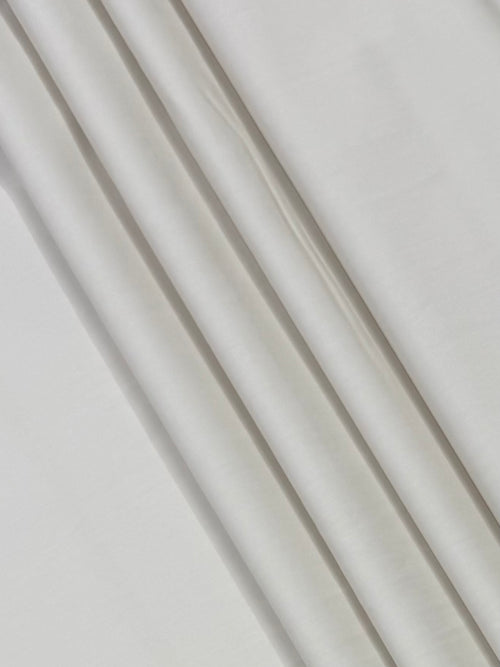 Close-up of white fabric with visible texture