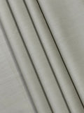 Close-up of beige fabric with folds
