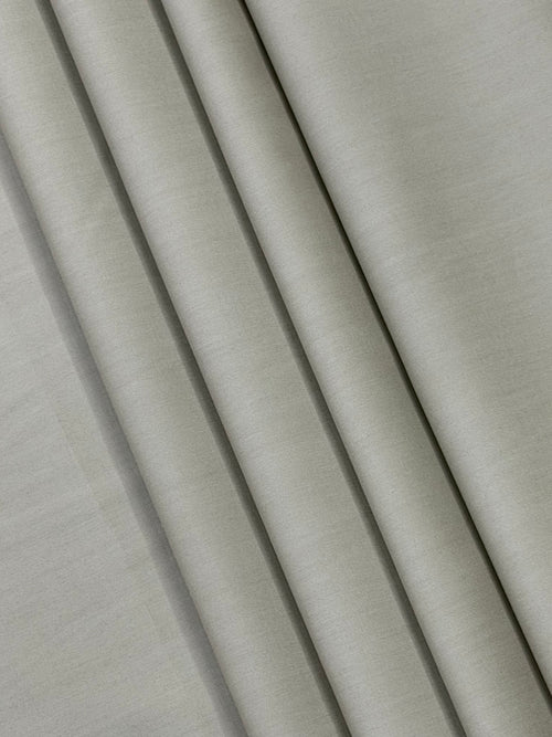 Close-up of beige fabric with folds
