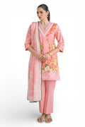 Woman wearing a pink traditional outfit with floral patterns on a white background
