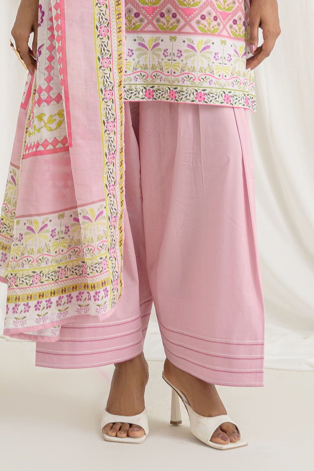 Pink traditional outfit with a matching dupatta on a white background
