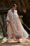 Woman in a floral dress walking a dog in a natural setting