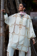 Woman wearing a white embroidered traditional outfit with a blurred background