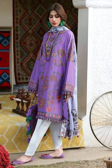 Woman wearing a purple embroidered outfit with a colorful background
