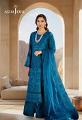 A woman models a teal blue embroidered Anarkali suit with matching wide-leg trousers and a sheer dupatta, set against an arched desert landscape backdrop. The brand name 'ASIM JOFA' is visible in the top left corner.