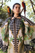 Woman wearing a patterned outfit with parrots on trees in the background