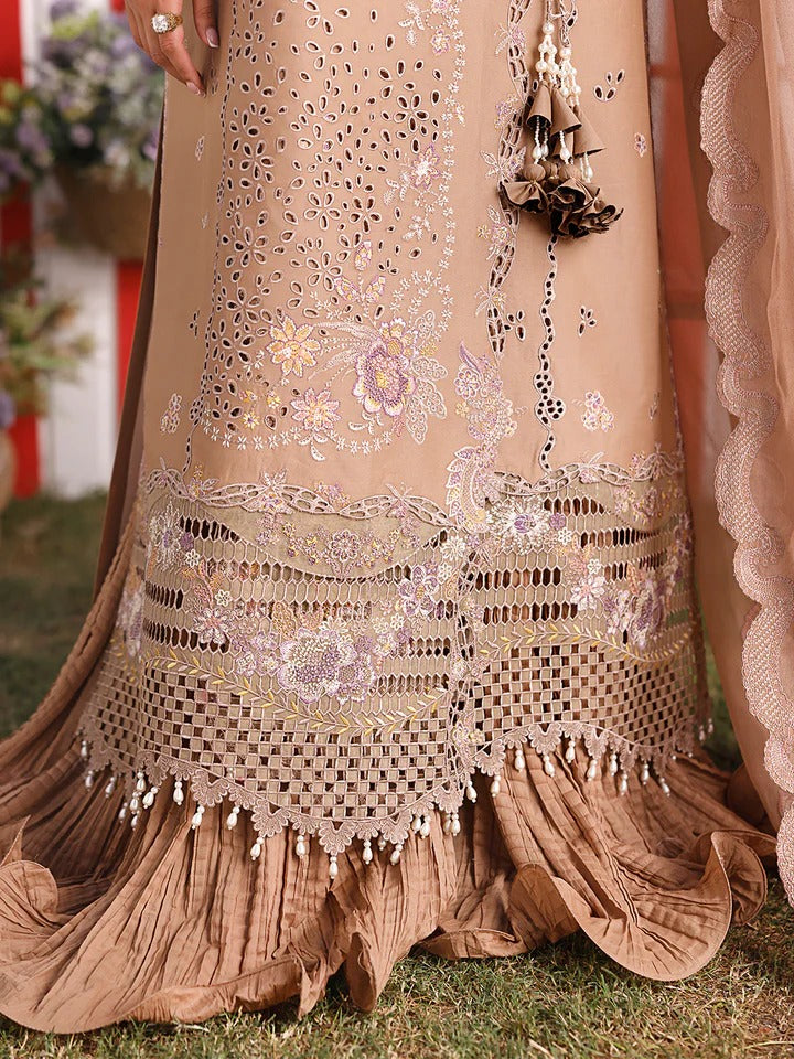 Beige embroidered traditional outfit with floral patterns on a grassy background