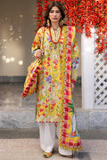 Woman wearing a colorful floral dress with a matching shawl in an outdoor setting.