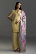 Woman wearing a traditional outfit with a yellow kurta and pink dupatta on a gray background