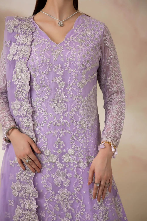 A close-up of a model wearing a lavender purple embroidered kurta with intricate silver floral embroidery and a matching sheer dupatta.
