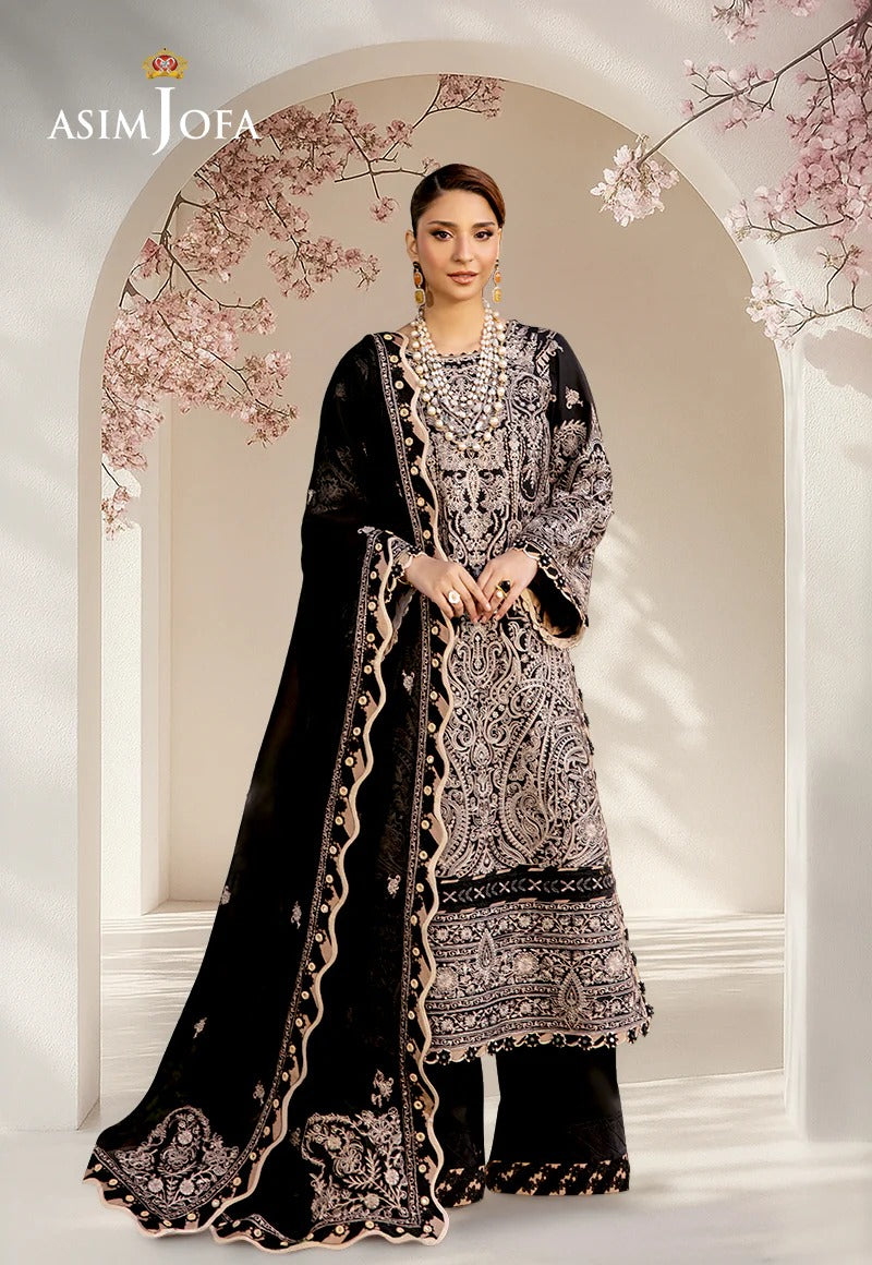 A woman models an ornate black and silver embroidered traditional outfit with a matching sheer dupatta, set against a decorative arched backdrop with pink blossoms. The brand name 'ASIM JOFA' is visible in the top left corner.