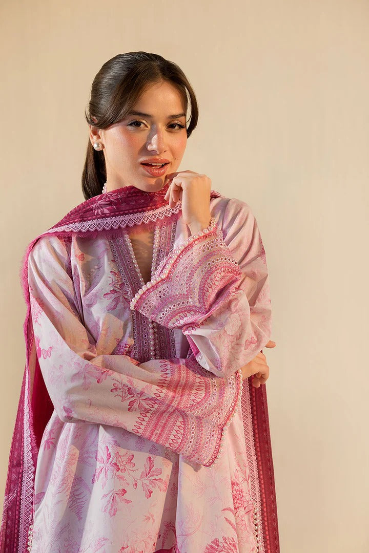 Woman wearing a pink and white embroidered traditional outfit against a beige background