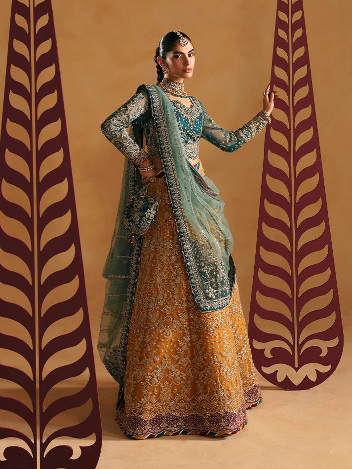 Woman in traditional outfit with intricate designs against a patterned background