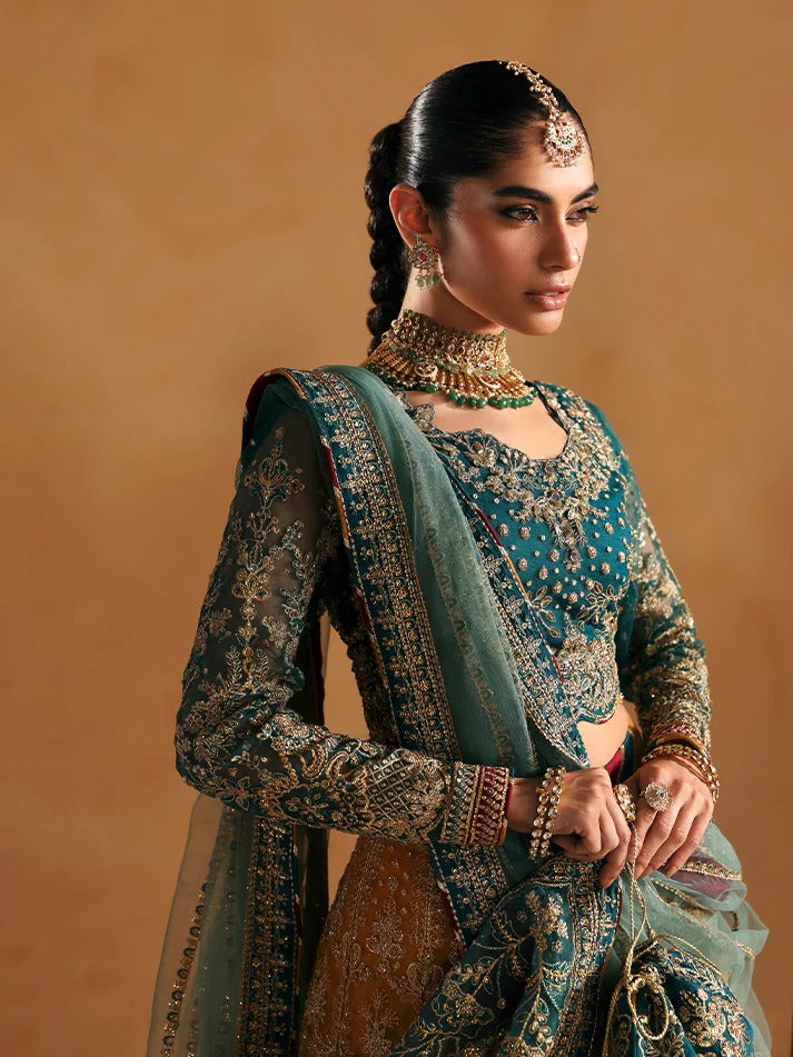 Woman in traditional embroidered outfit with jewelry against a beige background