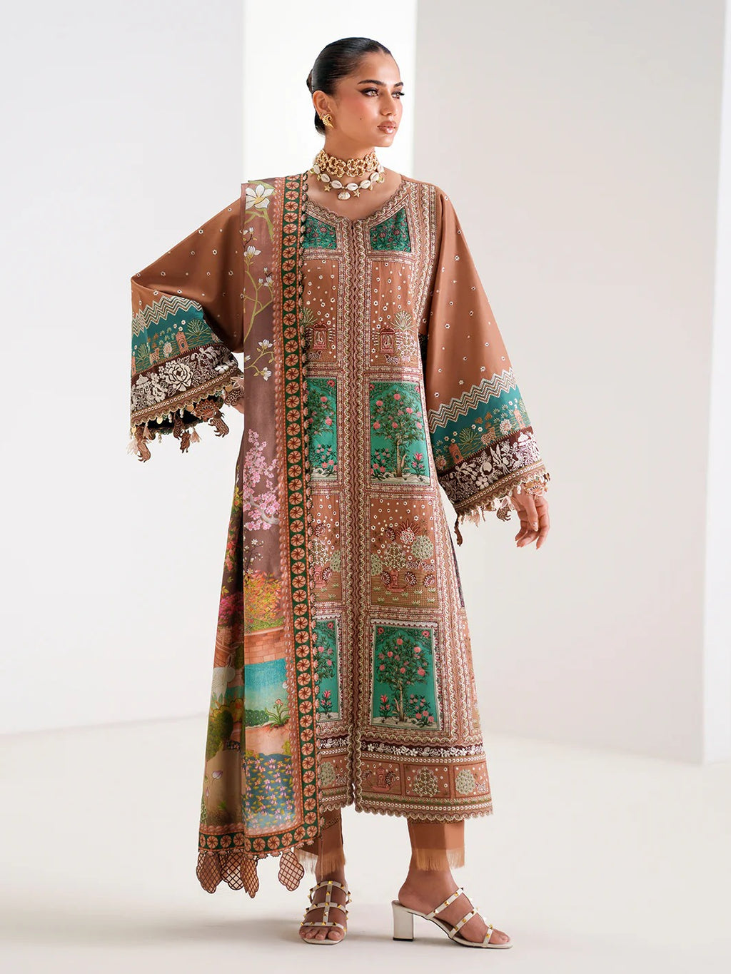 Woman wearing a patterned traditional outfit on a white background