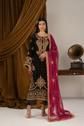 A woman models a traditional black and gold embroidered kurta set with a deep magenta dupatta draped over her shoulder, set against a backdrop of brown draped curtains and a vintage gramophone.