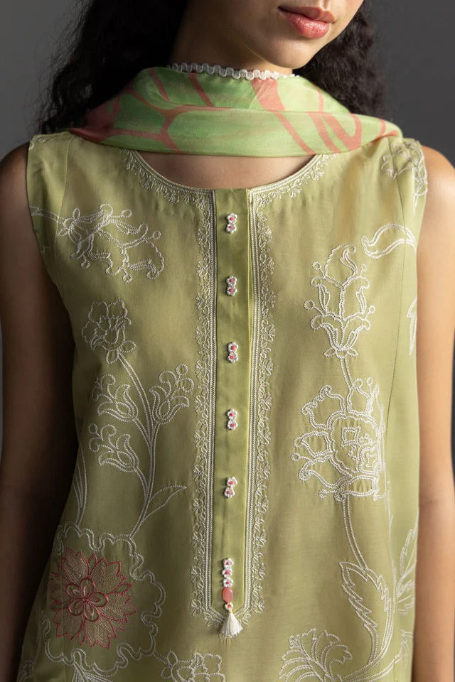Green embroidered sleeveless top worn by a person