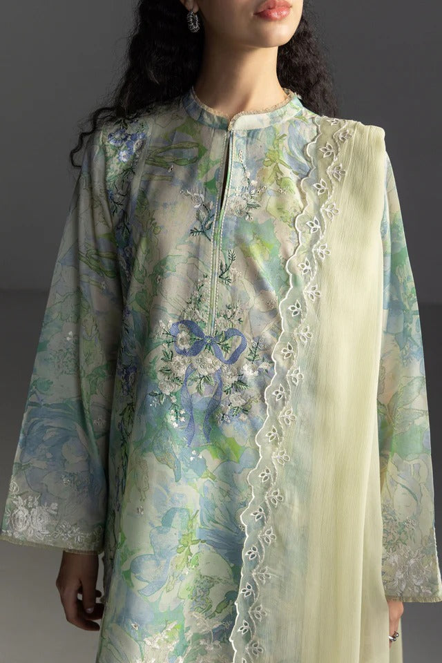 Woman wearing a floral embroidered kurta with a plain white dupatta against a dark background