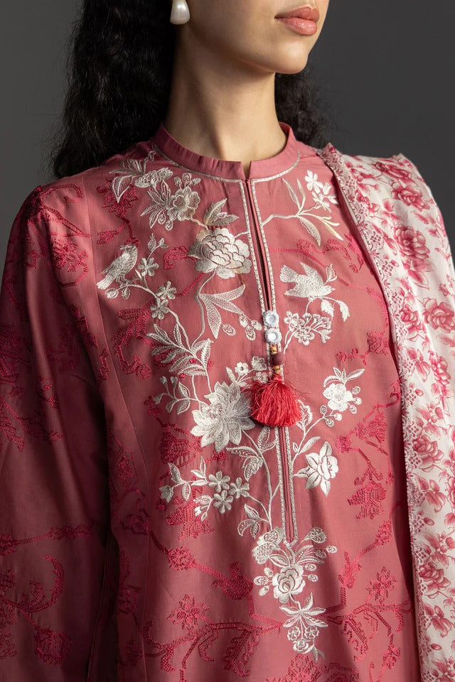 Red embroidered traditional outfit with a matching dupatta on a dark background