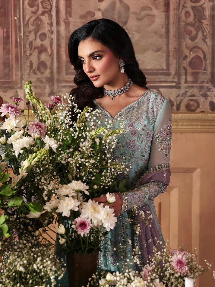 Woman holding a bouquet of flowers in an ornate indoor setting