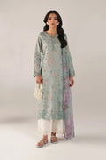 Woman wearing a light blue floral kurta with white pants on a plain background