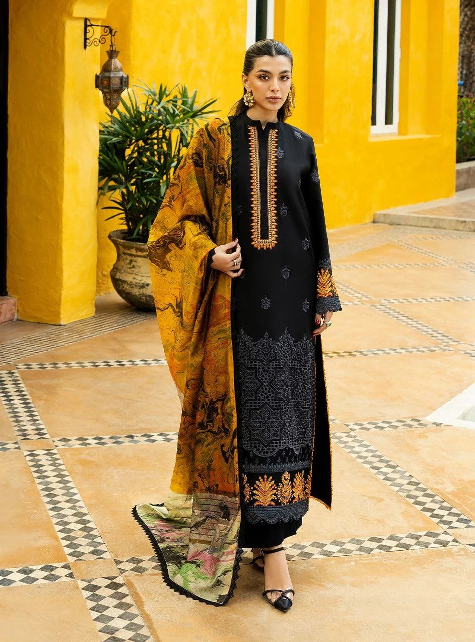Woman in a black and yellow traditional outfit standing in front of a yellow wall.