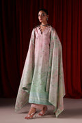 A model wearing a traditional South Asian outfit consisting of a light pink kurta with delicate floral embroidery, a matching light green dupatta with a floral pattern, and a pink shawl draped over her shoulders, set against a dark red curtain background.
