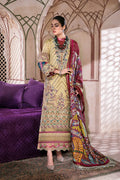 Woman in traditional embroidered outfit with a colorful dupatta in an ornate room.