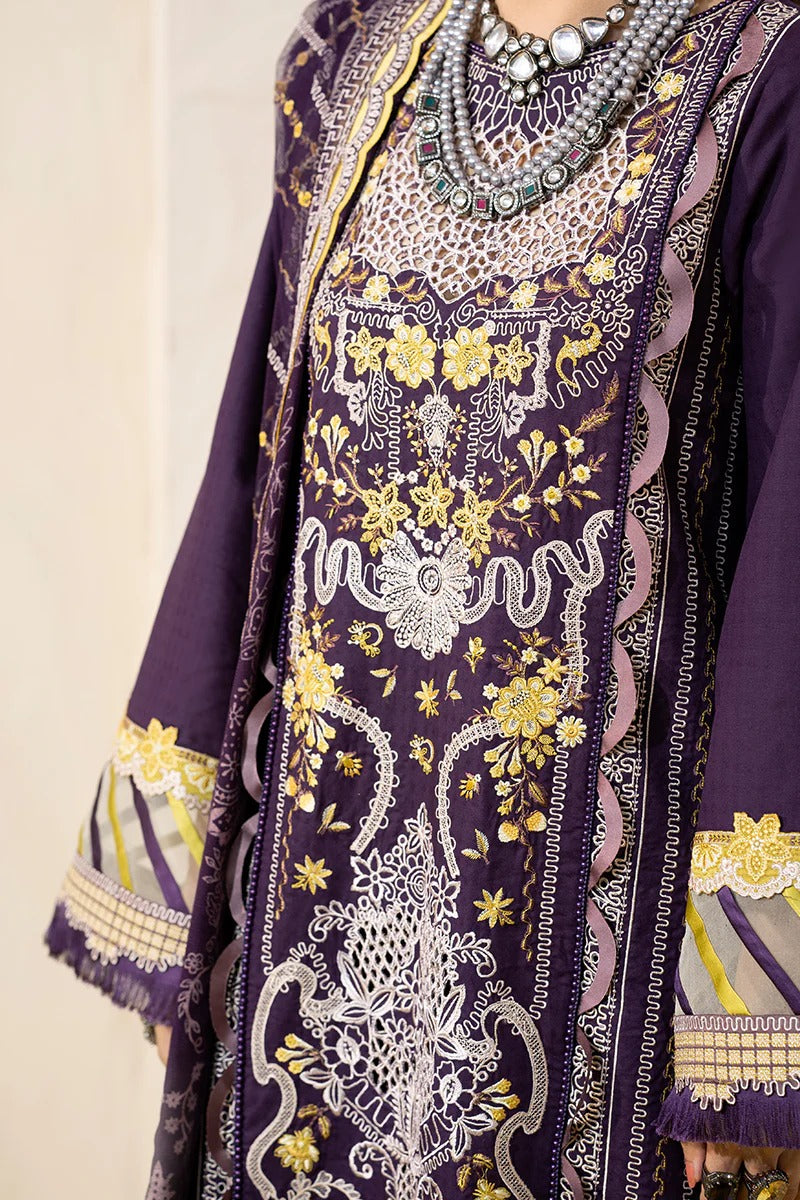 A close-up of a purple traditional embroidered garment with intricate gold and white floral embroidery, layered with a matching sheer purple dupatta and styled with a silver beaded necklace.