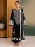 A woman modeling a black traditional kurta set with intricate white embroidery, featuring a matching embroidered dupatta, set against a warm indoor background.