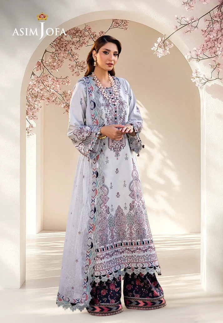 A woman models an Asim Jofa women's traditional outfit consisting of a light blue printed kurta, a matching dupatta, and dark floral wide-leg pants, set against an elegant beige arched backdrop with cherry blossom branches.