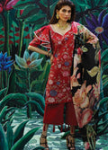 A woman models a red floral printed kurta with matching red pants and a black floral dupatta, posed against a painted tropical garden backdrop.