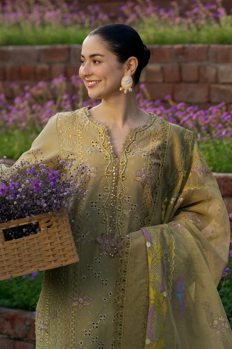 Woman in a traditional outfit holding a basket of flowers in a garden setting
