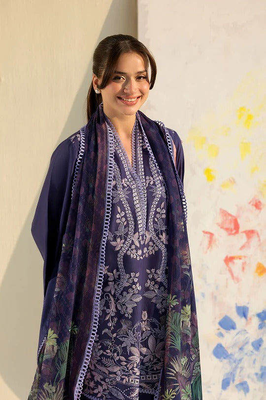 Woman wearing a dark blue floral patterned scarf against a colorful abstract background
