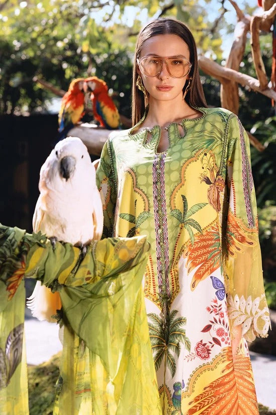 Woman in a colorful dress with parrots in a natural setting