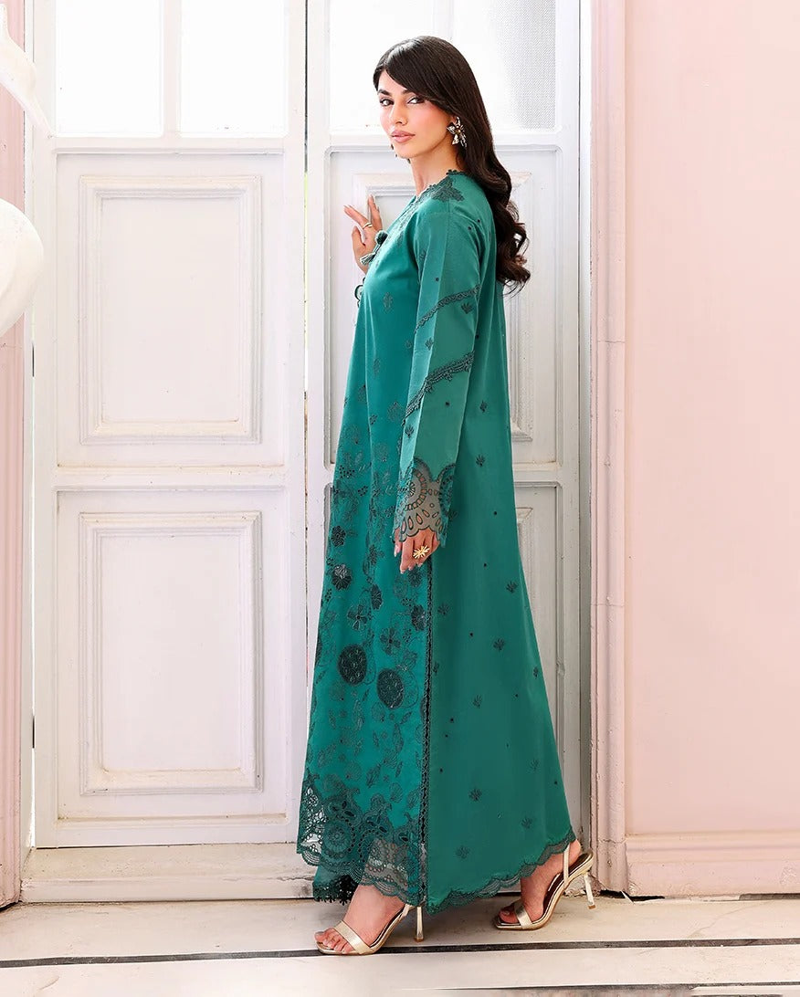 Woman in a teal dress with a white background